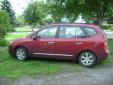 Bail pour Kia Rondo 2008 Rouge
